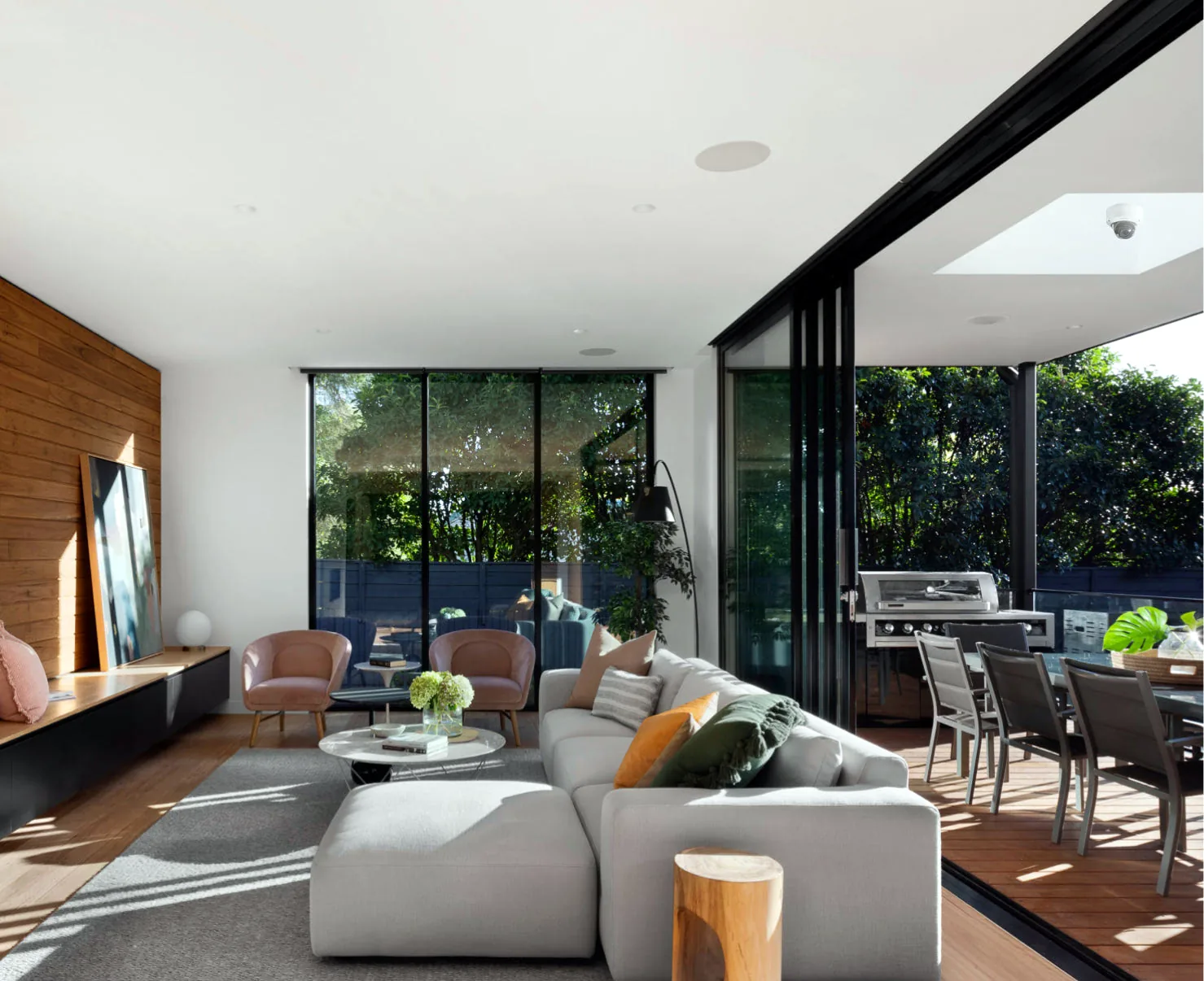 A discreet security camera under the eave of a covered outdoor living area