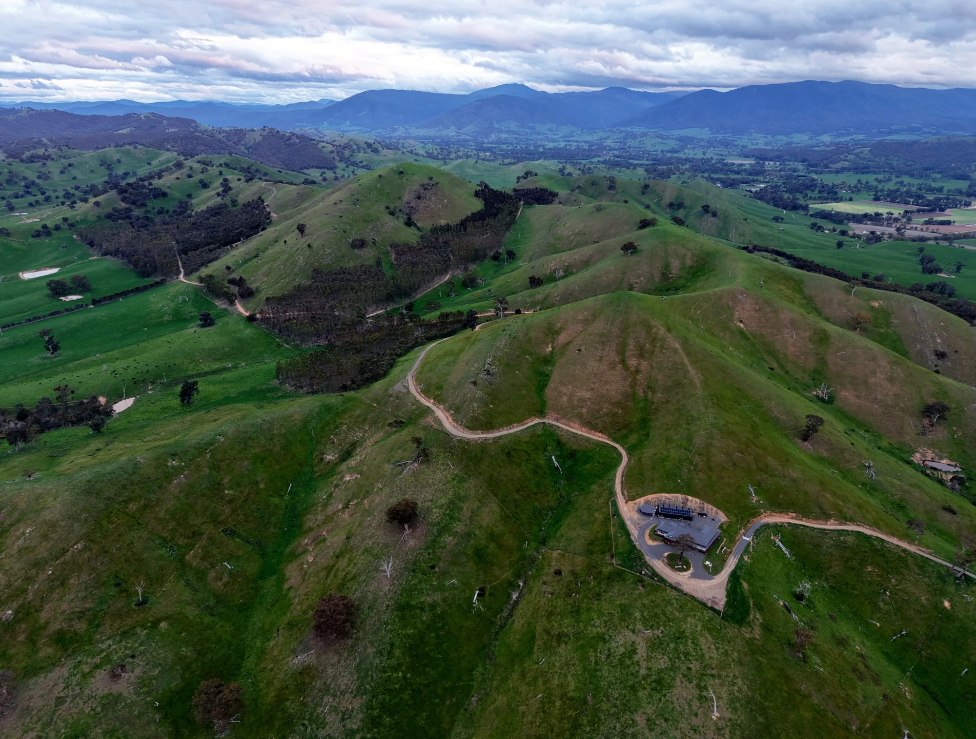 The Alexandra experience centre nestled among green high-country hills