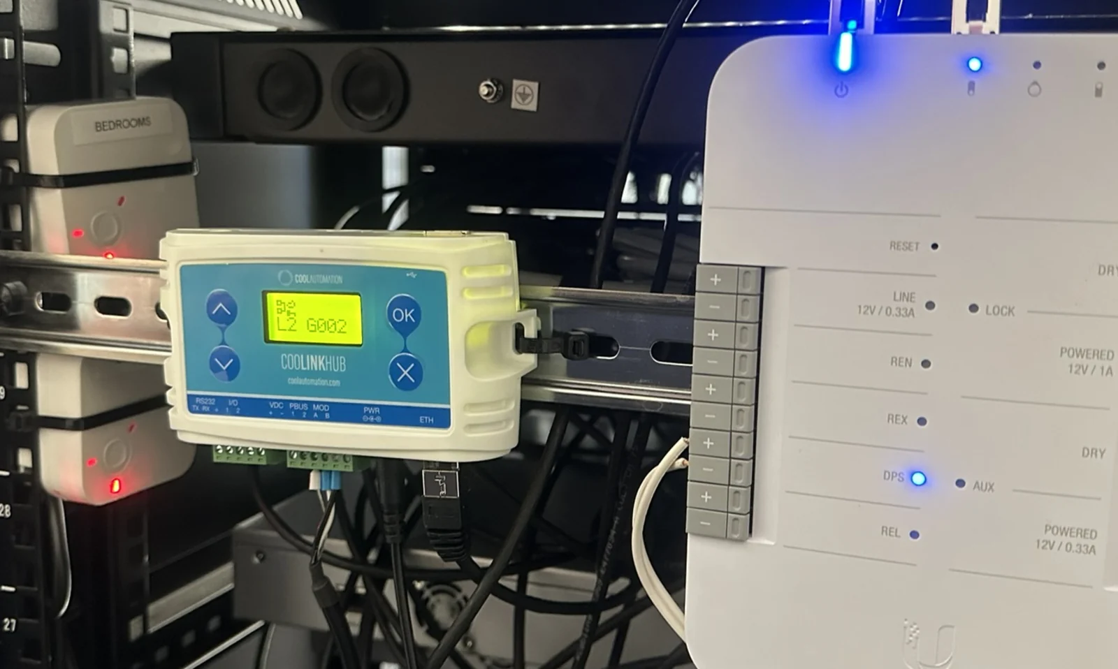 CoolAutomation CoolLinkHub in a home equipment rack, with bedroom zone modules beside it